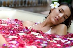 A warm aromatic bath to relieve pain in the neck